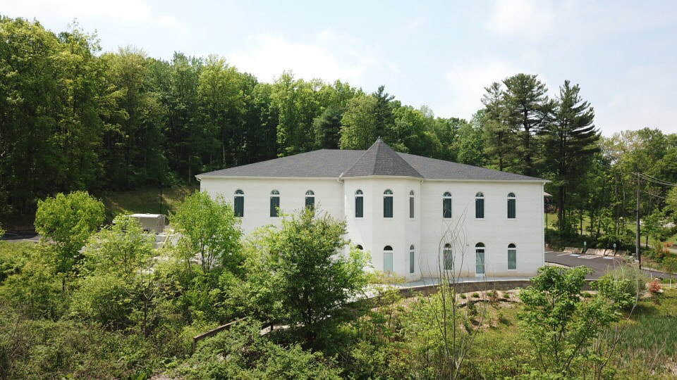 The masjid nestled among green trees in Wexford